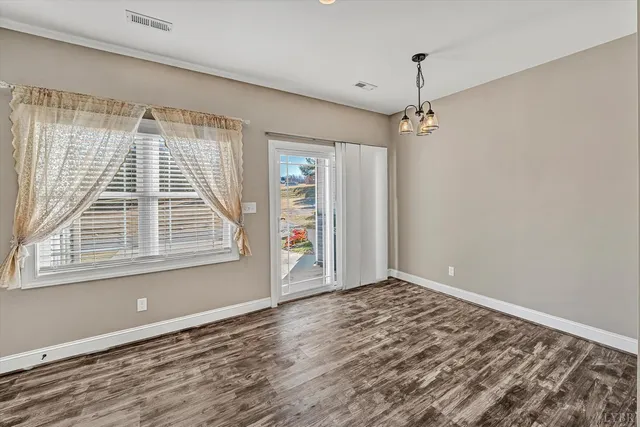 a bathroom with a sink a toilet a mirror a bathtub and shower