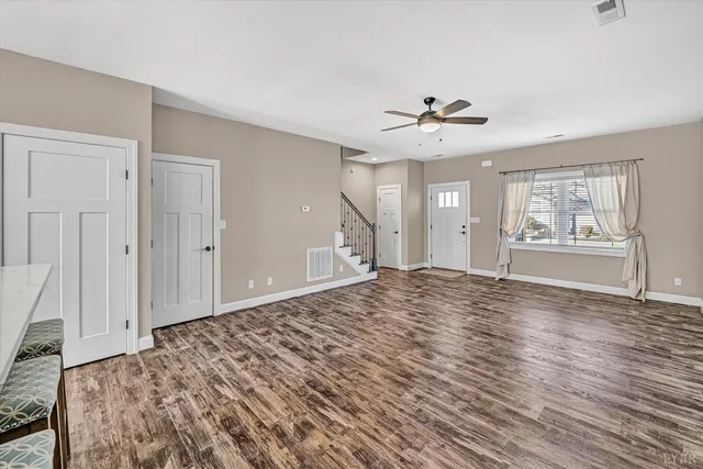 a view of a livingroom with furniture and wooden floor