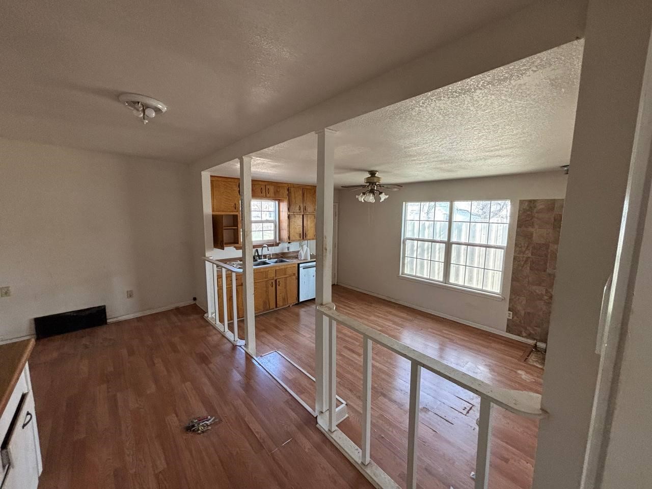 308 Martin Street Bangs, TX 76823 - Photo 5 of 14 a kitchen with stainless steel appliances granite countertop a stove a sink and a refrigerator