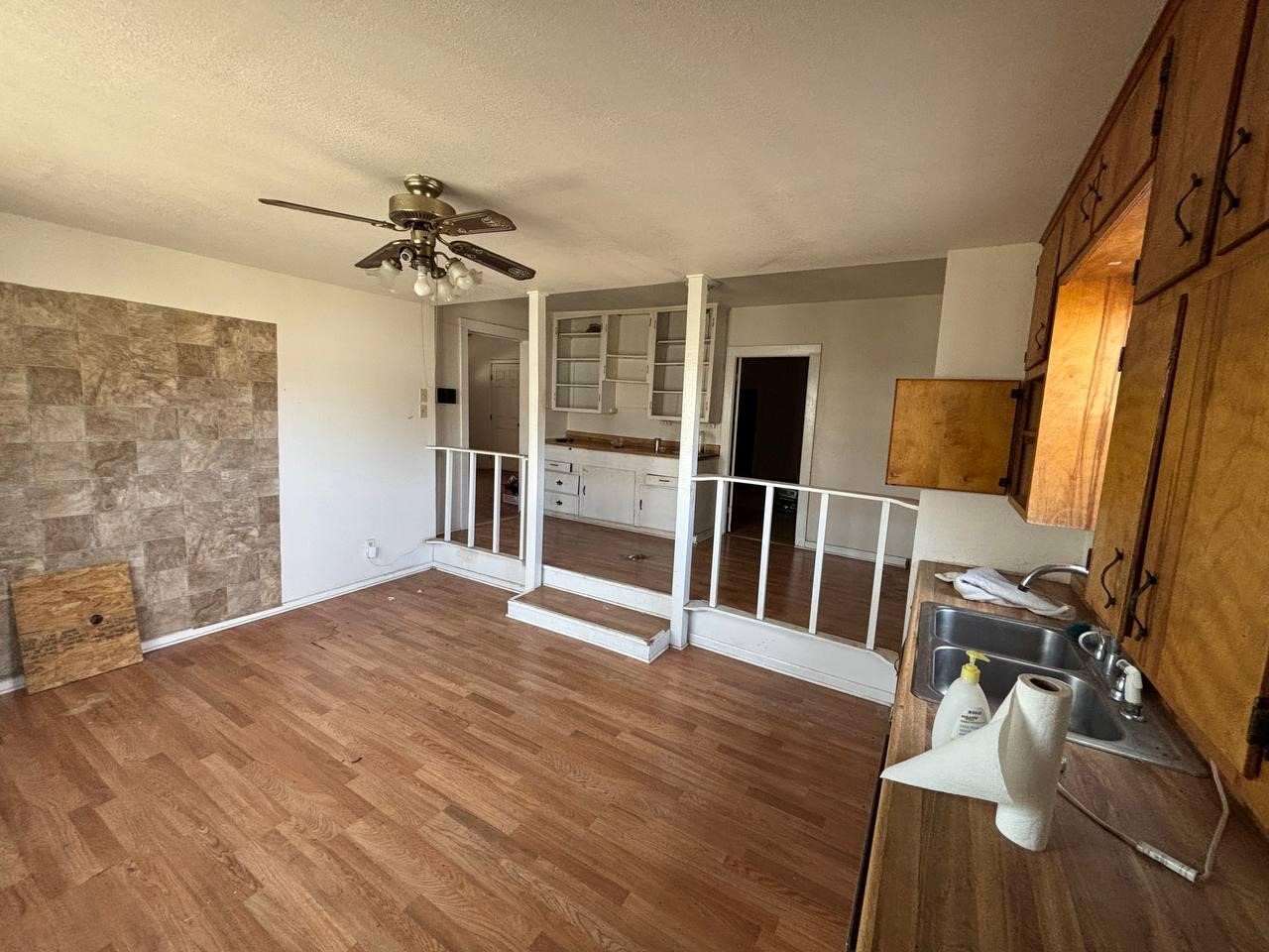 308 Martin Street Bangs, TX 76823 - Photo 6 of 14 a view of empty room with wooden floor and fan