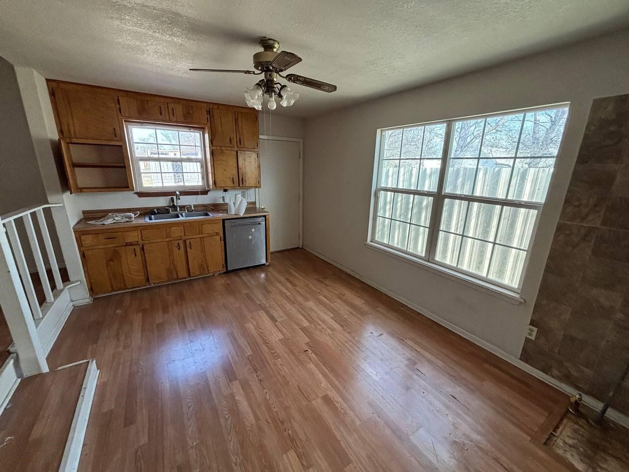 308 Martin Street Bangs, TX 76823 - Photo 9 of 14 a large kitchen with a wooden floor and large window