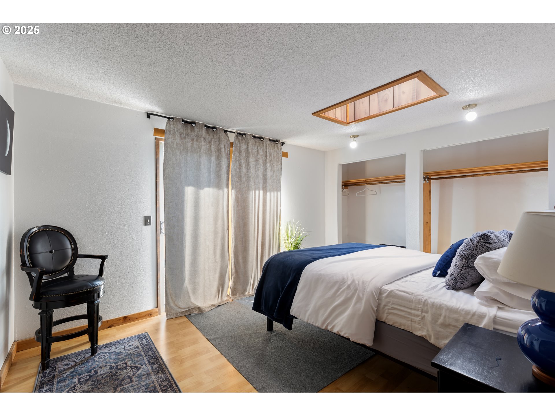930 Prescott Lane Springfield, OR 97477 - Photo 11 of 31 a bedroom with a bed and a chair