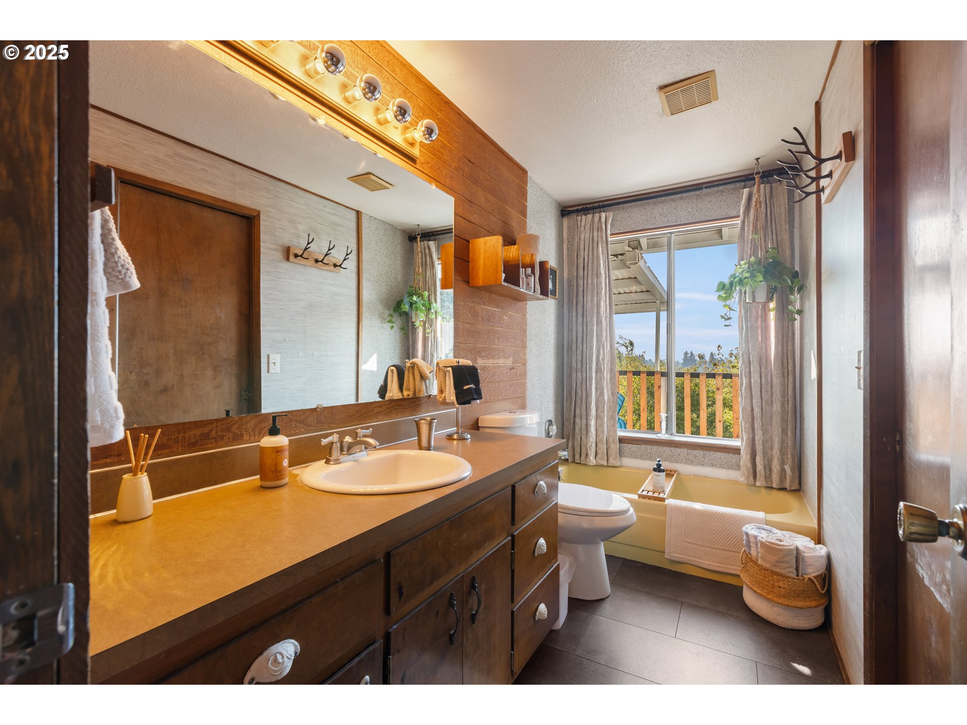 930 Prescott Lane Springfield, OR 97477 - Photo 17 of 31 a bathroom with a double vanity sink toilet mirror and bathtub