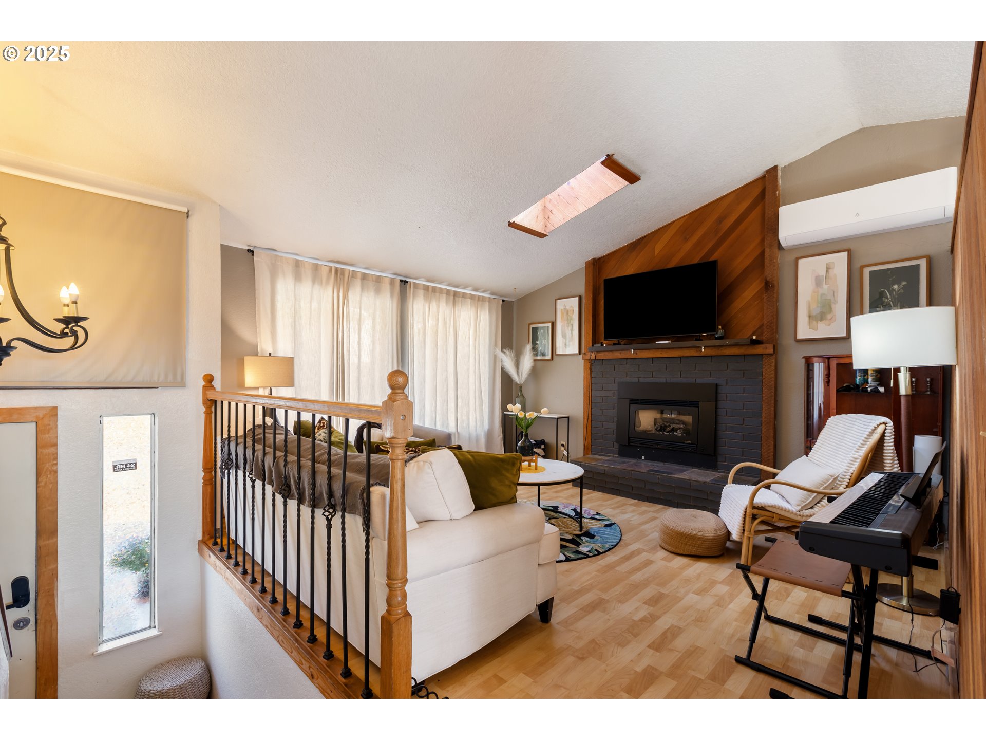 930 Prescott Lane Springfield, OR 97477 - Photo 2 of 31 a living room with furniture a flat screen tv and a fireplace