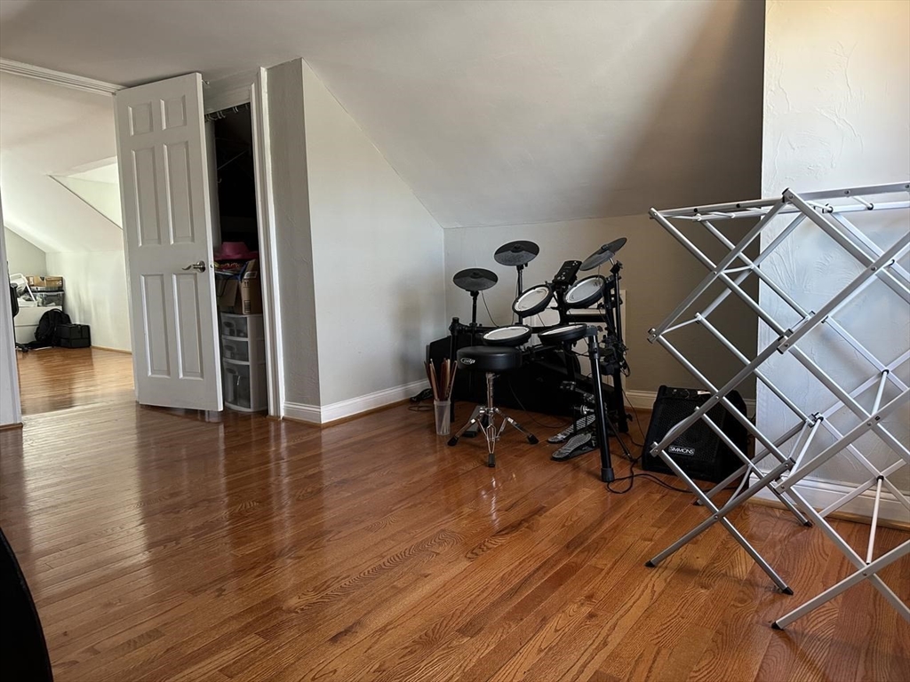 123 Faneuil Street, Unit 2 Boston, MA 02135 - Photo 12 of 12 a view of a workspace with wooden floor