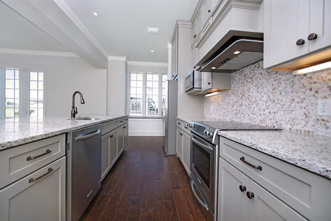 Lot 8 Tresca Place Santa Rosa Beach, FL 32459 - Photo 18 of 43 a kitchen with granite countertop a sink stainless steel appliances and cabinets