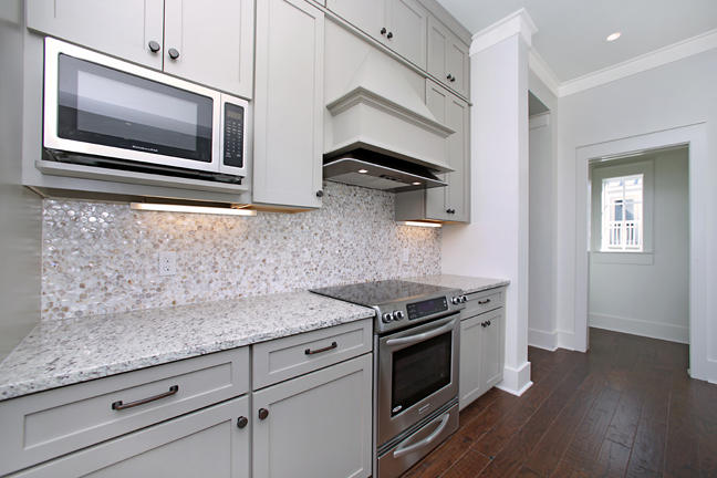 Lot 8 Tresca Place Santa Rosa Beach, FL 32459 - Photo 19 of 43 a kitchen with granite countertop cabinets stainless steel appliances and wooden floor
