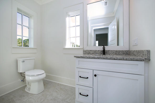 Lot 8 Tresca Place Santa Rosa Beach, FL 32459 - Photo 30 of 43 a bathroom with a toilet sink and mirror