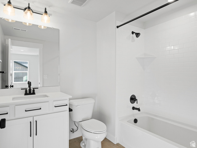 1711 West Canyon Rim Road North Lehi, UT 84048 - Photo 23 of 31 Bathroom featuring a white vanity with matte black hardware, a rectangular undermount sink, and a quartz-finish countertop