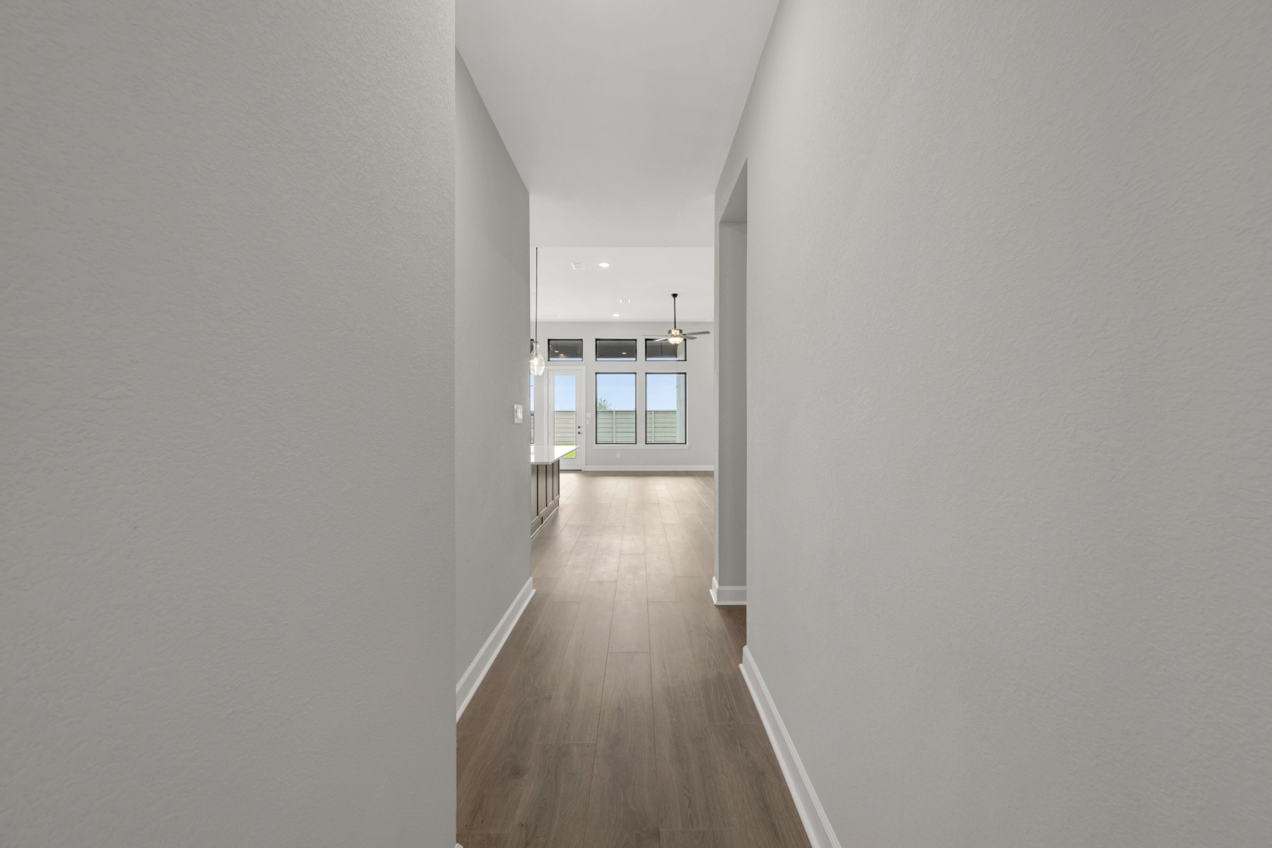 5407 Mango Blfs Street Manvel, TX 77578 - Photo 11 of 50 a view of a hallway with wooden floor