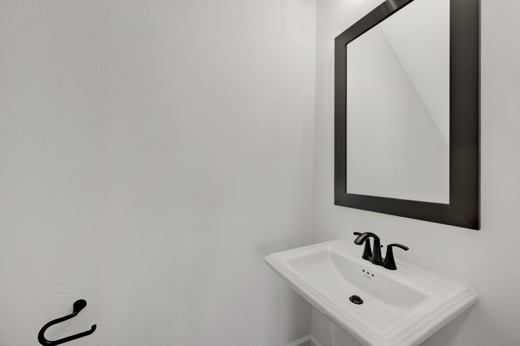 5407 Mango Blfs Street Manvel, TX 77578 - Photo 15 of 50 a bathroom with a sink and a mirror