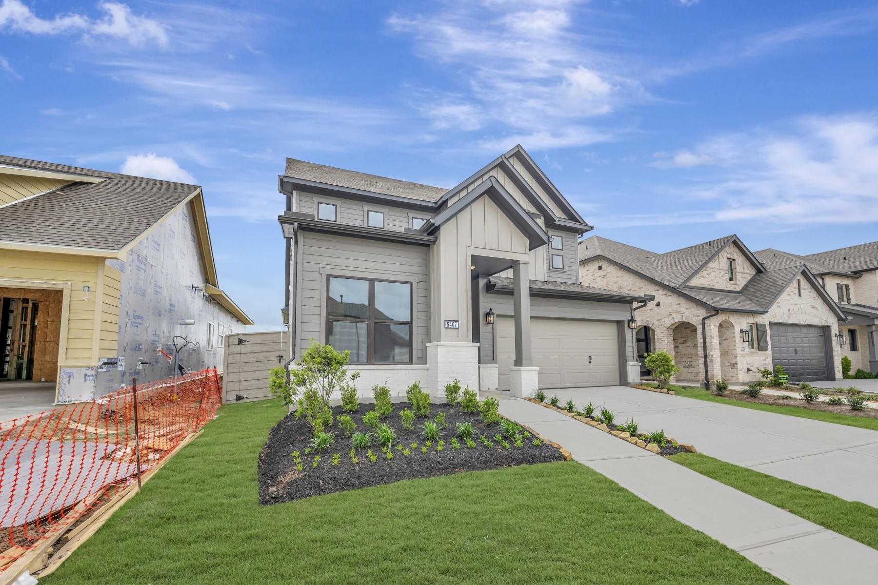 5407 Mango Blfs Street Manvel, TX 77578 - Photo 3 of 50 a front view of a house with a yard