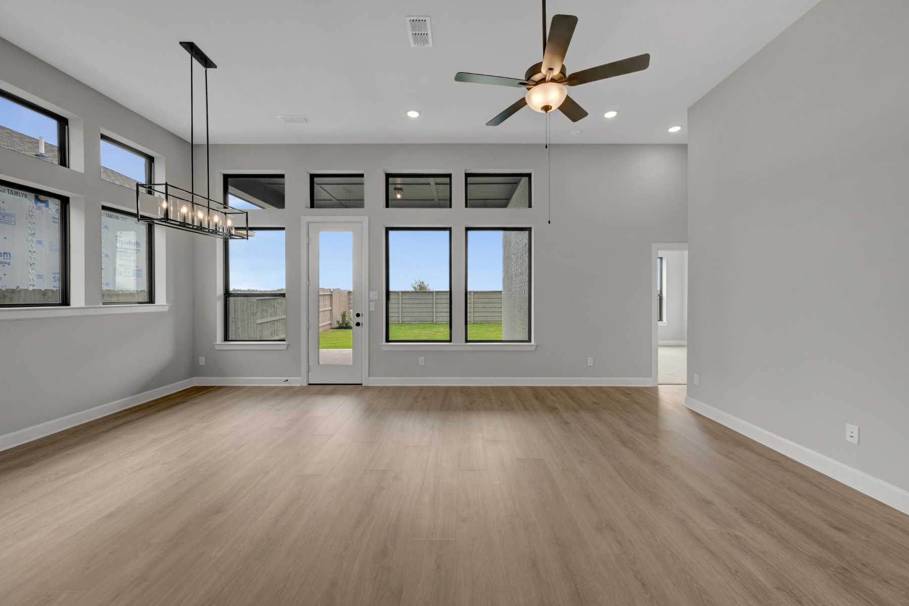 5407 Mango Blfs Street Manvel, TX 77578 - Photo 30 of 50 a view of an empty room with a window and wooden floor