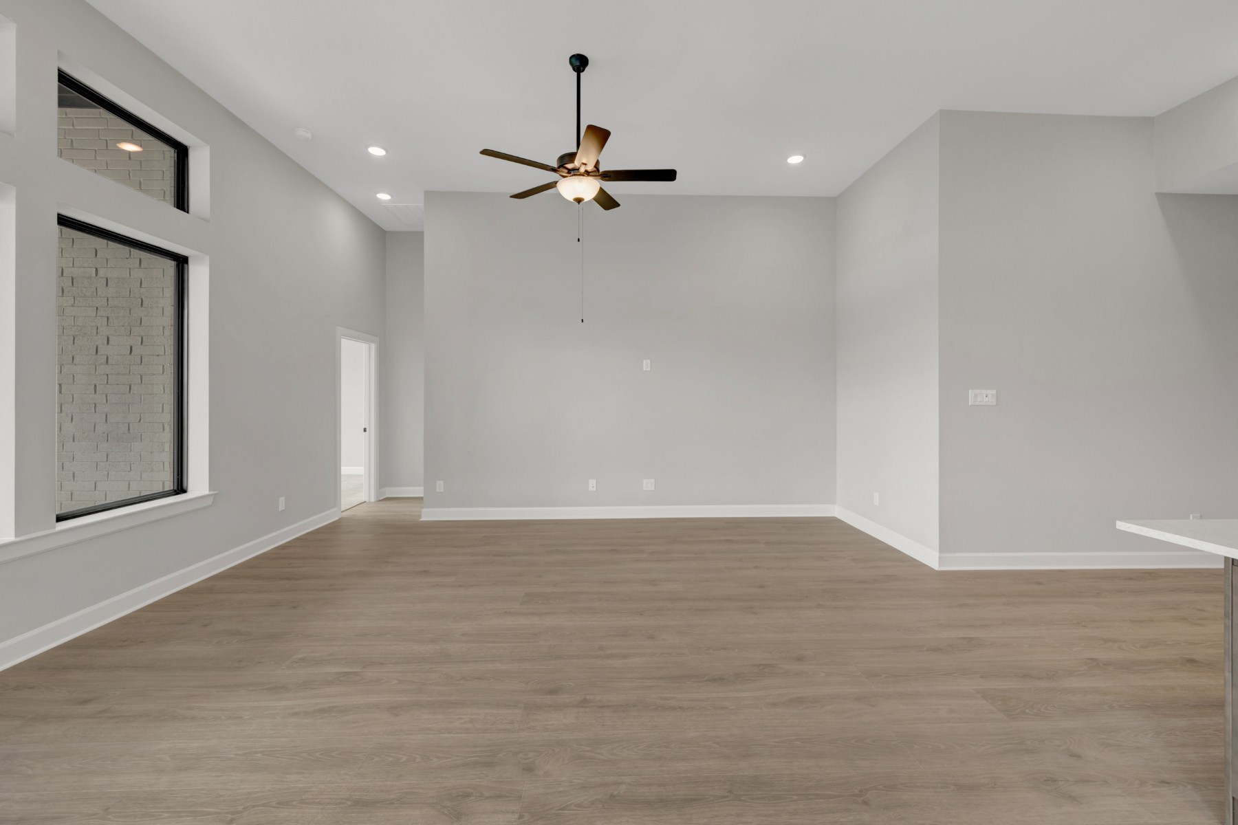 5407 Mango Blfs Street Manvel, TX 77578 - Photo 31 of 50 wooden floor in an empty room with a window