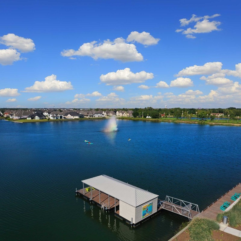 5407 Mango Blfs Street Manvel, TX 77578 - Photo 47 of 50 a view of a lake with houses in the back