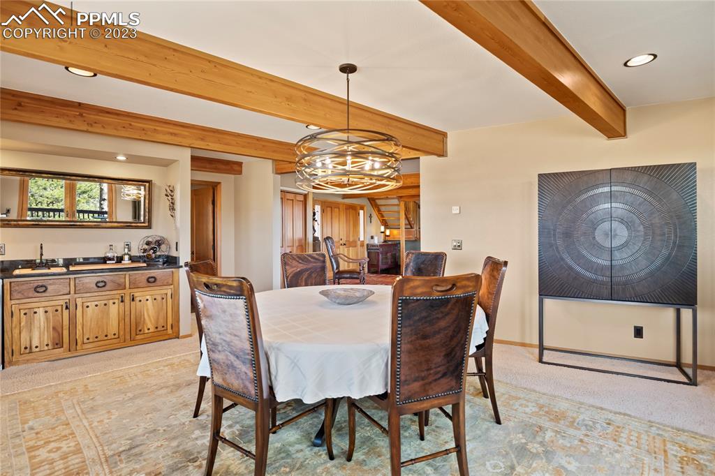 4528 Sheep Patch Road Golden, CO 80403 - Photo 16 of 40 a view of a dining room with furniture window and wooden floor