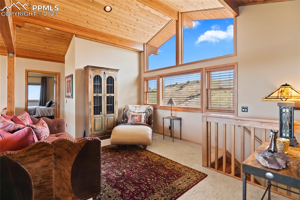 4528 Sheep Patch Road Golden, CO 80403 - Photo 18 of 40 a living room with furniture and a table