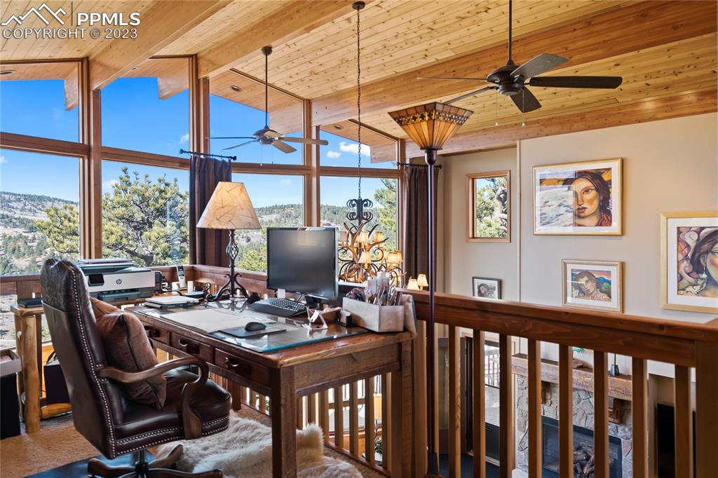 4528 Sheep Patch Road Golden, CO 80403 - Photo 19 of 40 a view of a dining room with furniture window and outside view