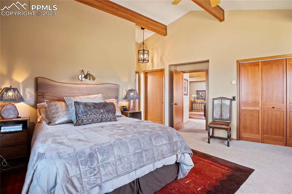 4528 Sheep Patch Road Golden, CO 80403 - Photo 21 of 40 a bed room with a bed and a chair