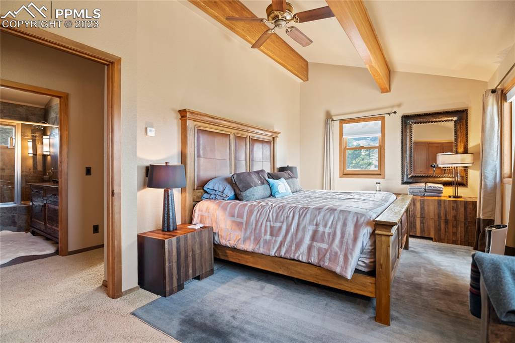 4528 Sheep Patch Road Golden, CO 80403 - Photo 24 of 40 a bed room with a bed and a balcony