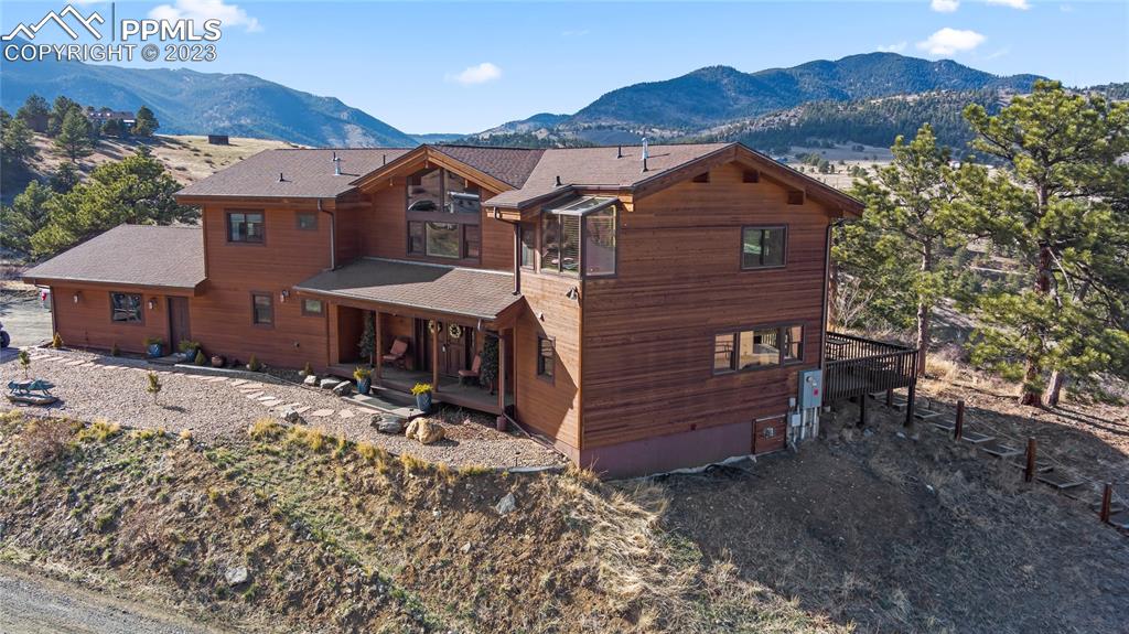 4528 Sheep Patch Road Golden, CO 80403 - Photo 3 of 40 a view of a house with a yard and furniture