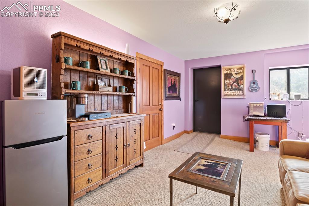 4528 Sheep Patch Road Golden, CO 80403 - Photo 31 of 40 a kitchen with stainless steel appliances a refrigerator and a stove top oven