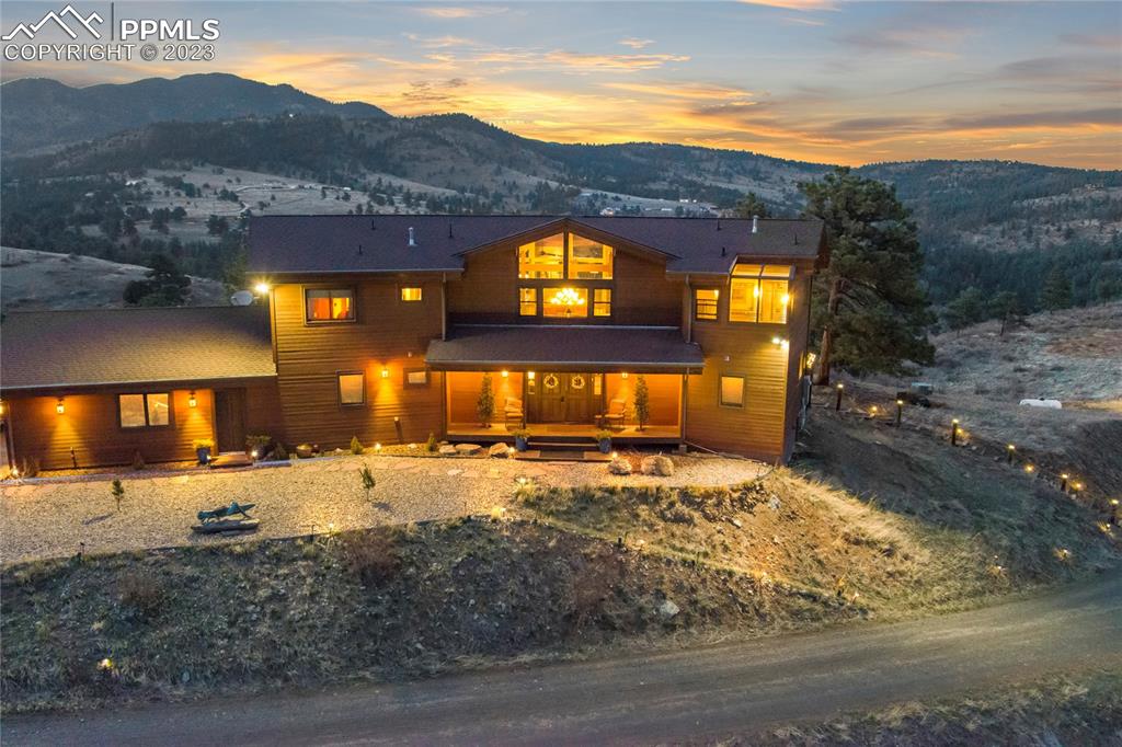4528 Sheep Patch Road Golden, CO 80403 - Photo 38 of 40 a view of a house with a yard