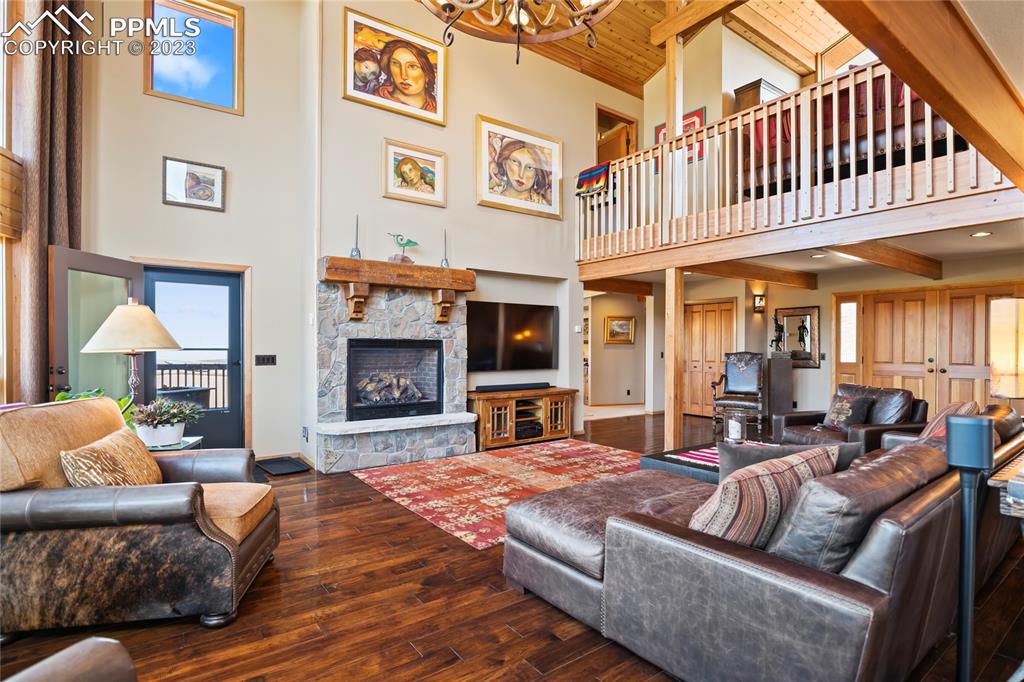 4528 Sheep Patch Road Golden, CO 80403 - Photo 7 of 40 a large living room with furniture fireplace and flat screen tv