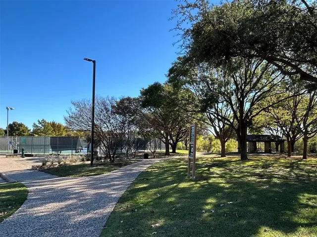 a big yard with large trees
