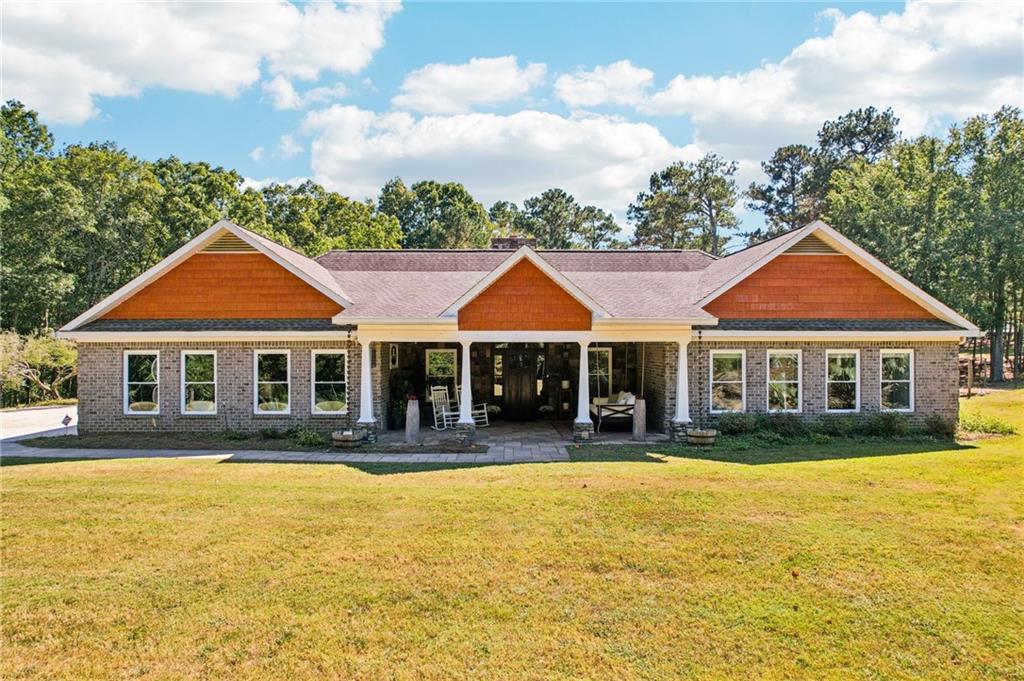 a front view of a house with a yard