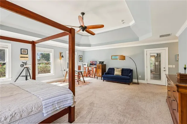 a living room with furniture a wooden floor and a table and chairs