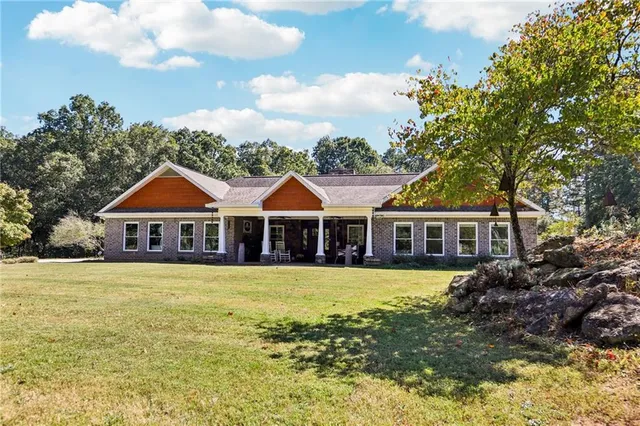 an aerial view of a house with a swimming pool