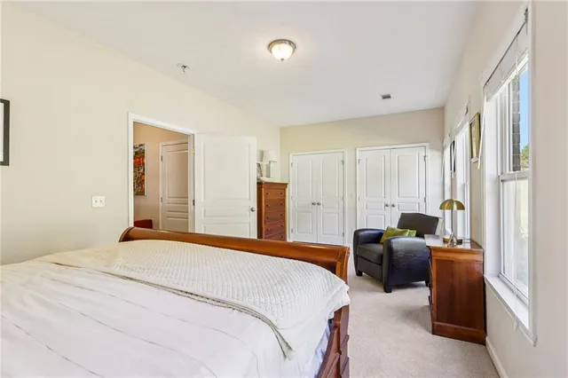 an aerial view of a house with a swimming pool and backyard