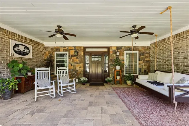 a living room with lots of furniture and wooden floor