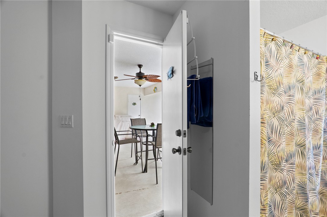 934 Bermuda Avenue Sebastian, FL 32958 - Photo 7 of 31 a view of dining room with wooden floor and hallway