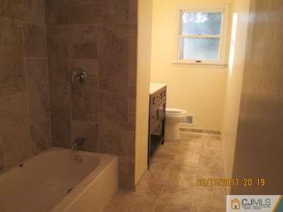 17 Columbia Road Old Bridge, NJ 08859 - Photo 3 of 6 a bathroom with a tub and a shower