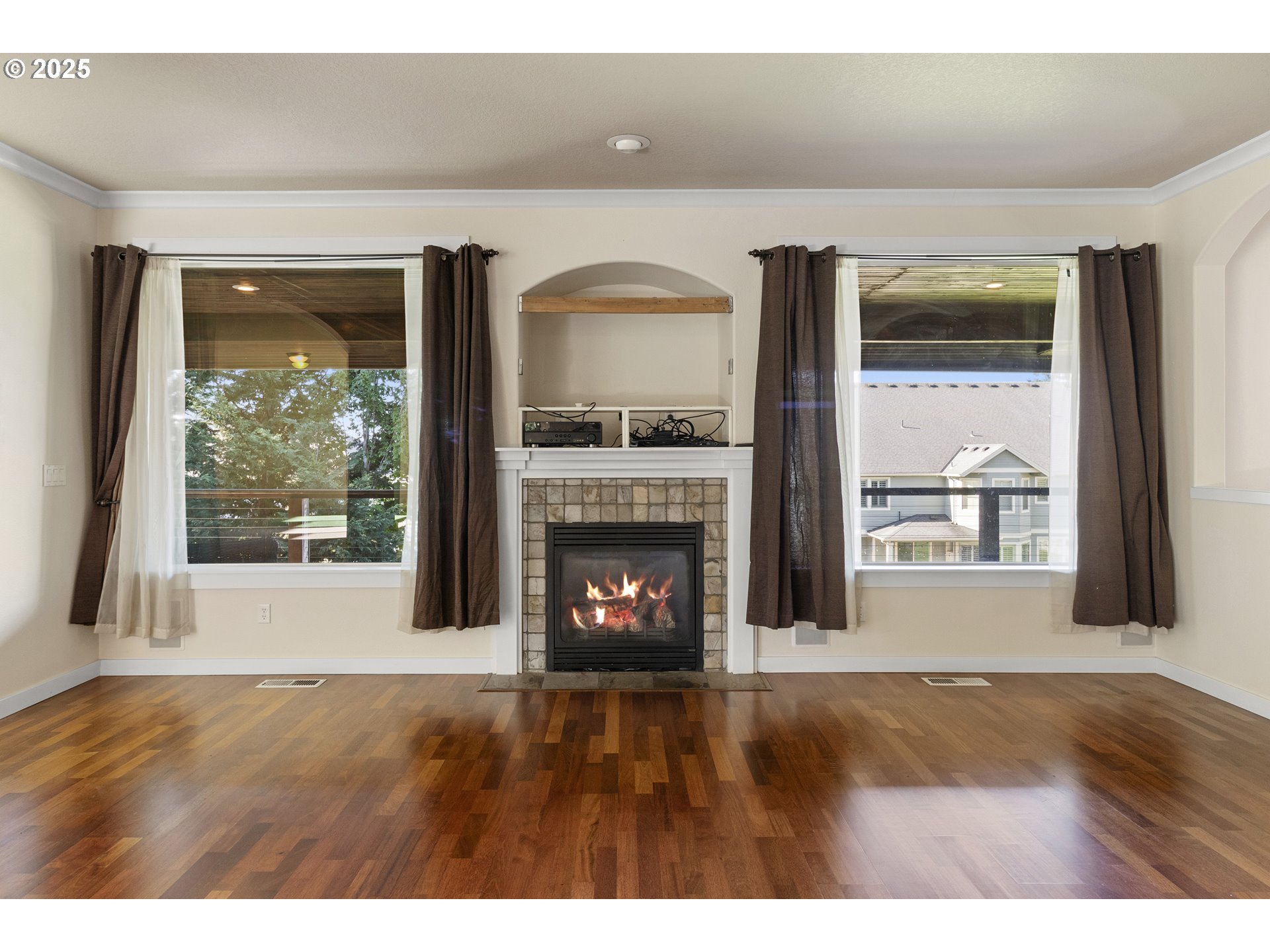 14822 Southeast Natalya Street Happy Valley, OR 97086 - Photo 12 of 48 a view of an empty room with a fireplace and a window