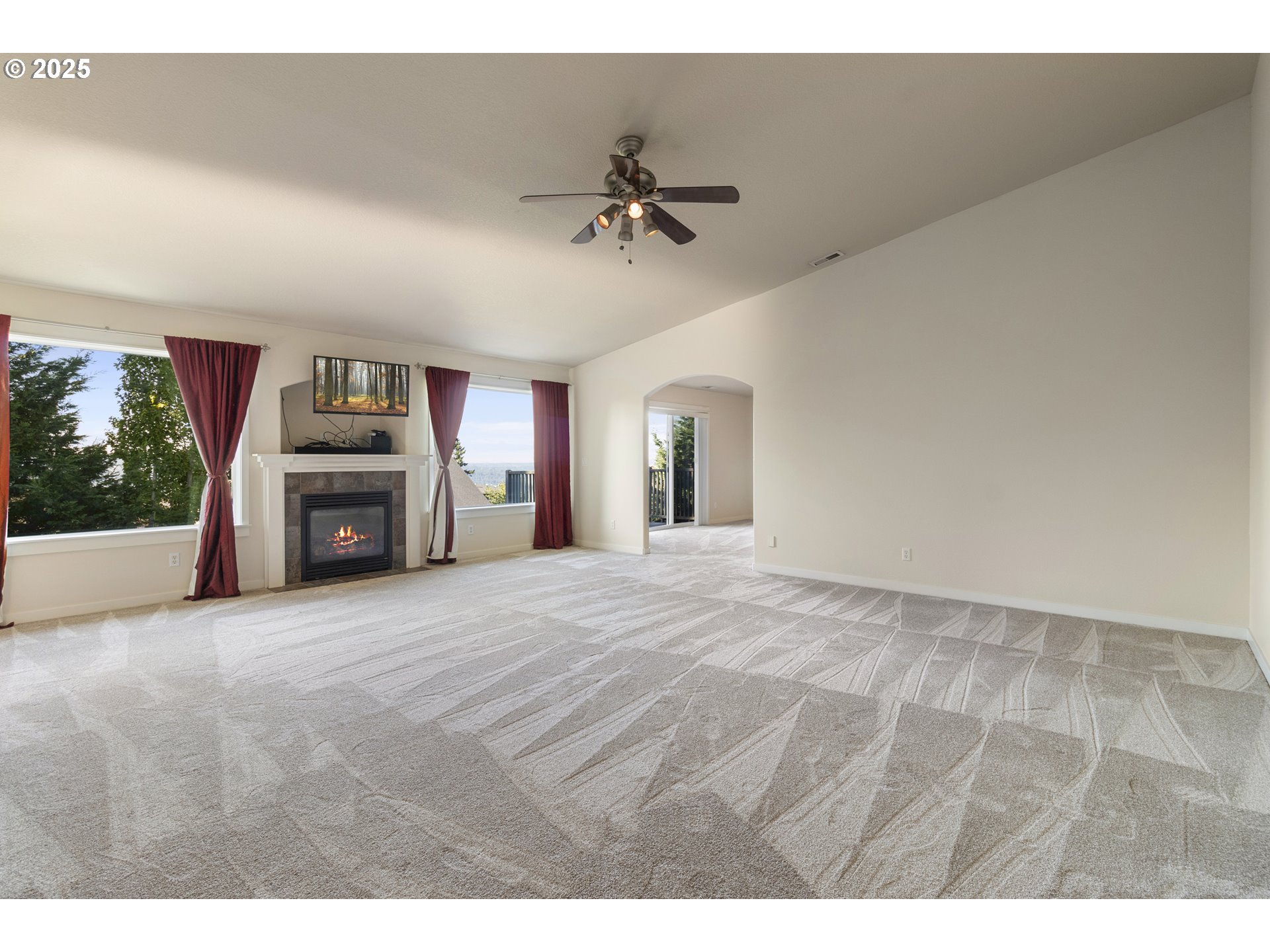 14822 Southeast Natalya Street Happy Valley, OR 97086 - Photo 27 of 48 a view of an empty room with a fireplace and a window