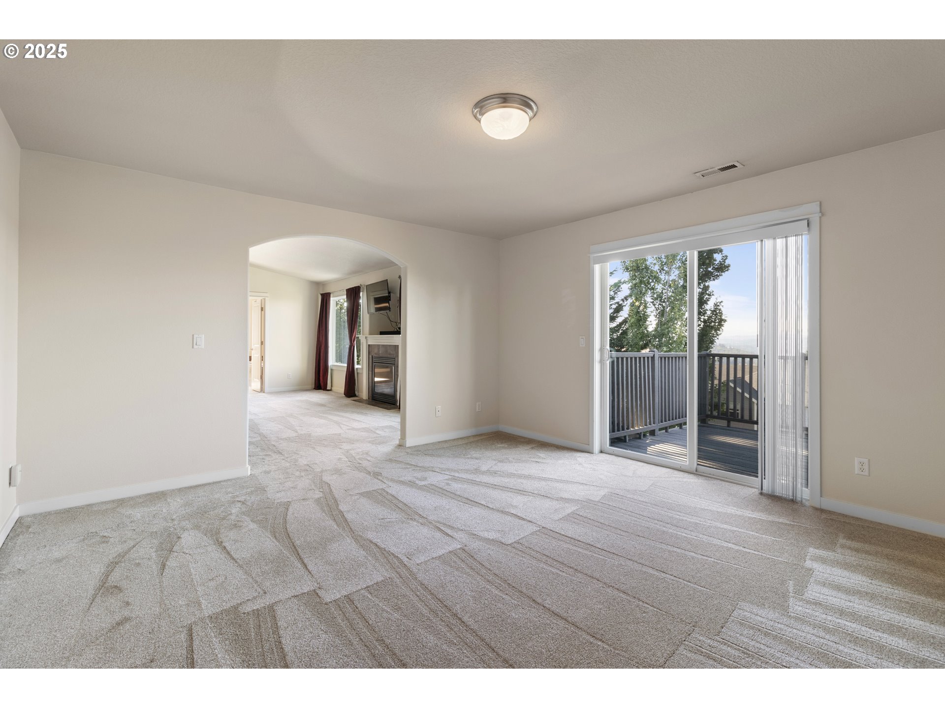 14822 Southeast Natalya Street Happy Valley, OR 97086 - Photo 29 of 48 a view of an empty room with wooden floor and a window