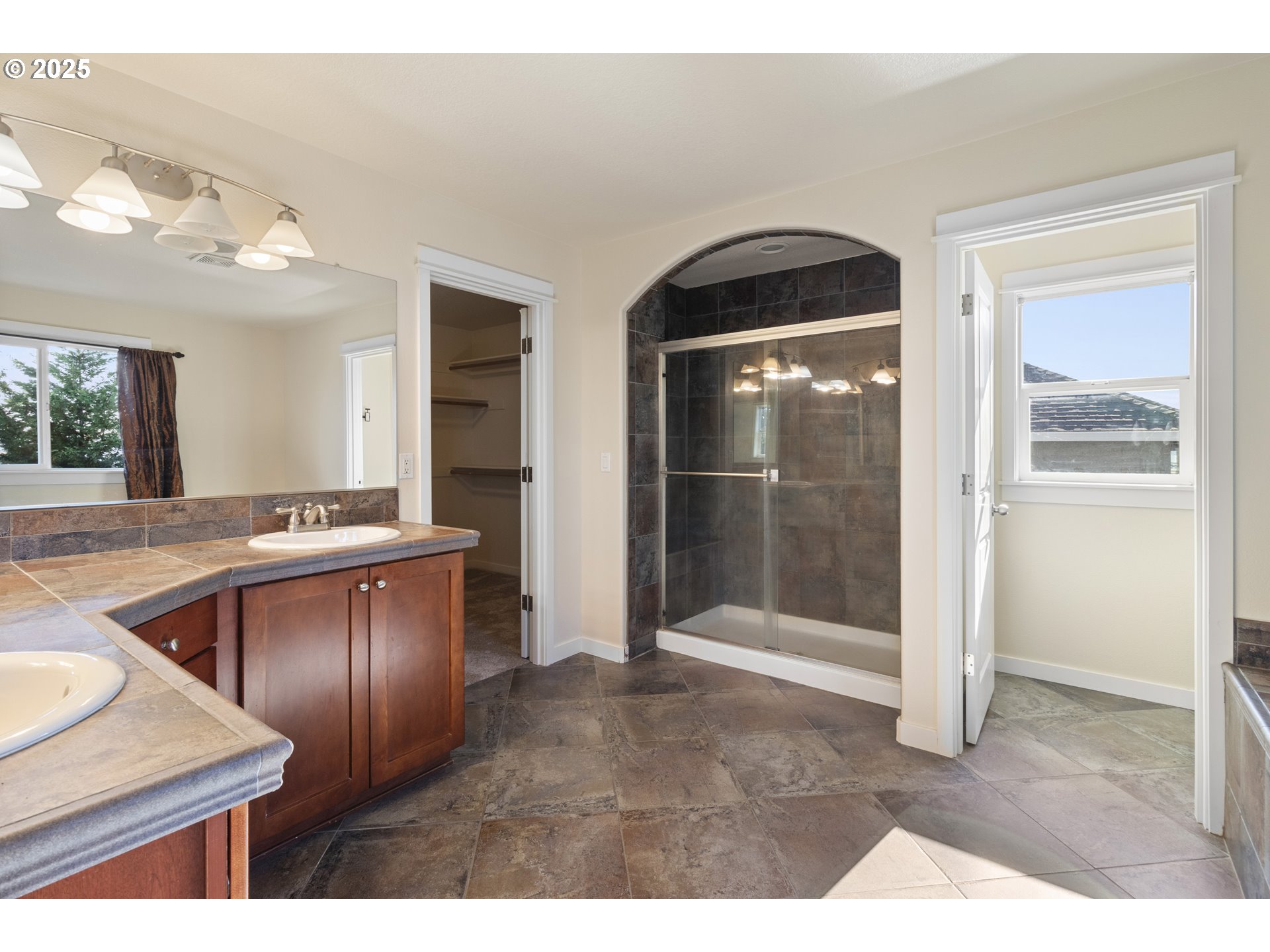 14822 Southeast Natalya Street Happy Valley, OR 97086 - Photo 33 of 48 a open kitchen with stainless steel appliances granite countertop a refrigerator and a sink