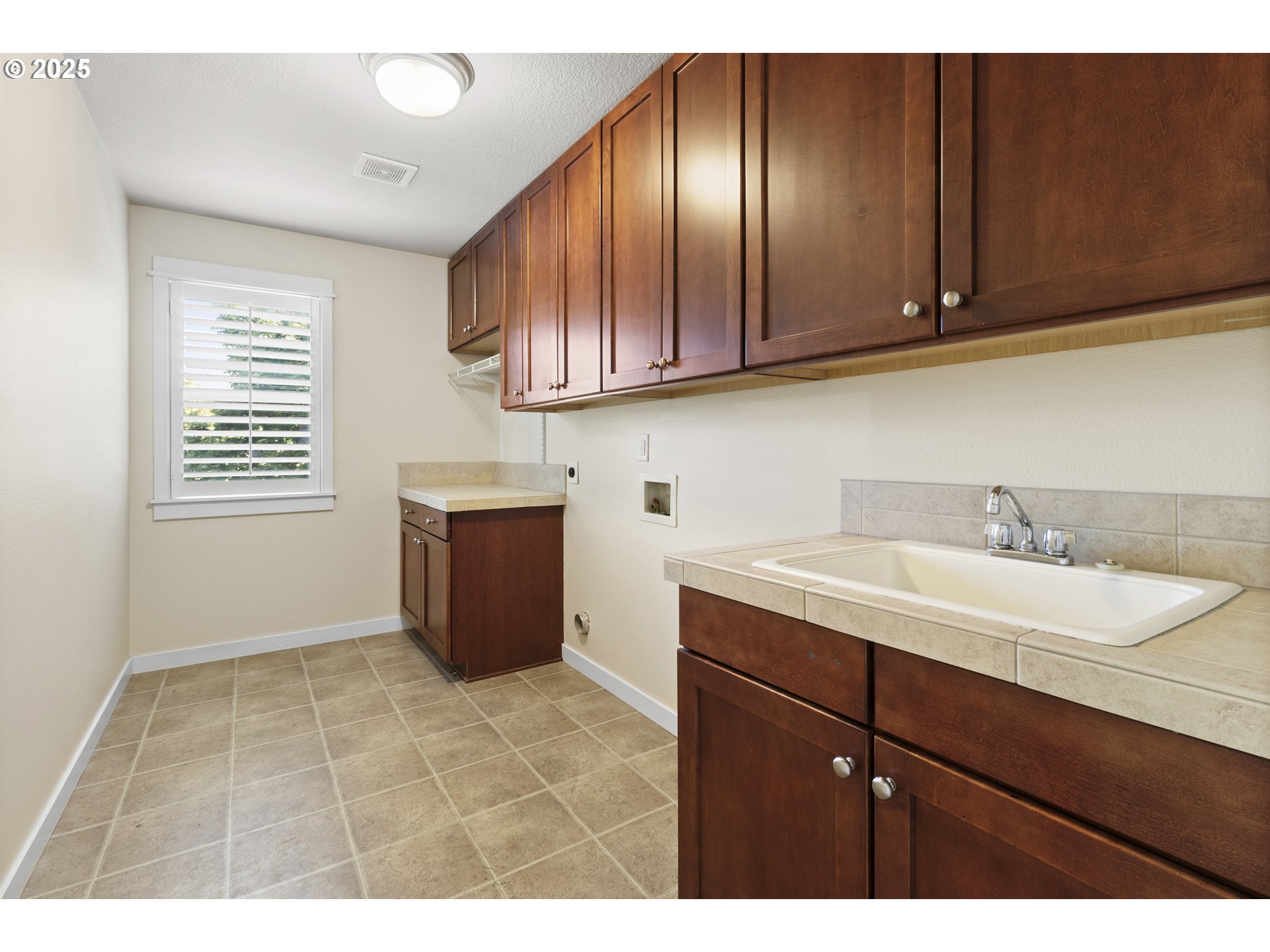 14822 Southeast Natalya Street Happy Valley, OR 97086 - Photo 41 of 48 a kitchen with a sink cabinets and window