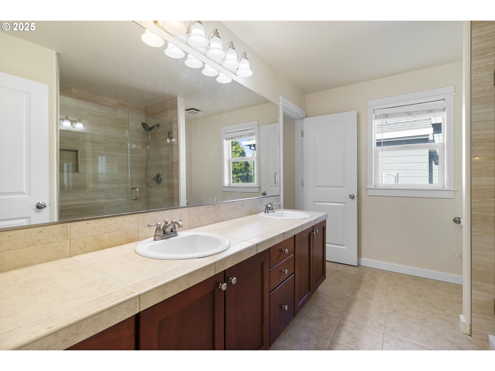 14822 Southeast Natalya Street Happy Valley, OR 97086 - Photo 42 of 48 a bathroom with a sink double vanity and a mirror