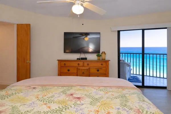 a bedroom with a bed and a lamp