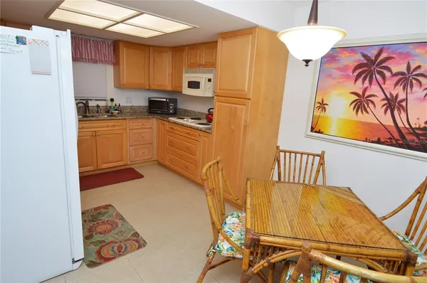 a dining room with furniture and chandelier