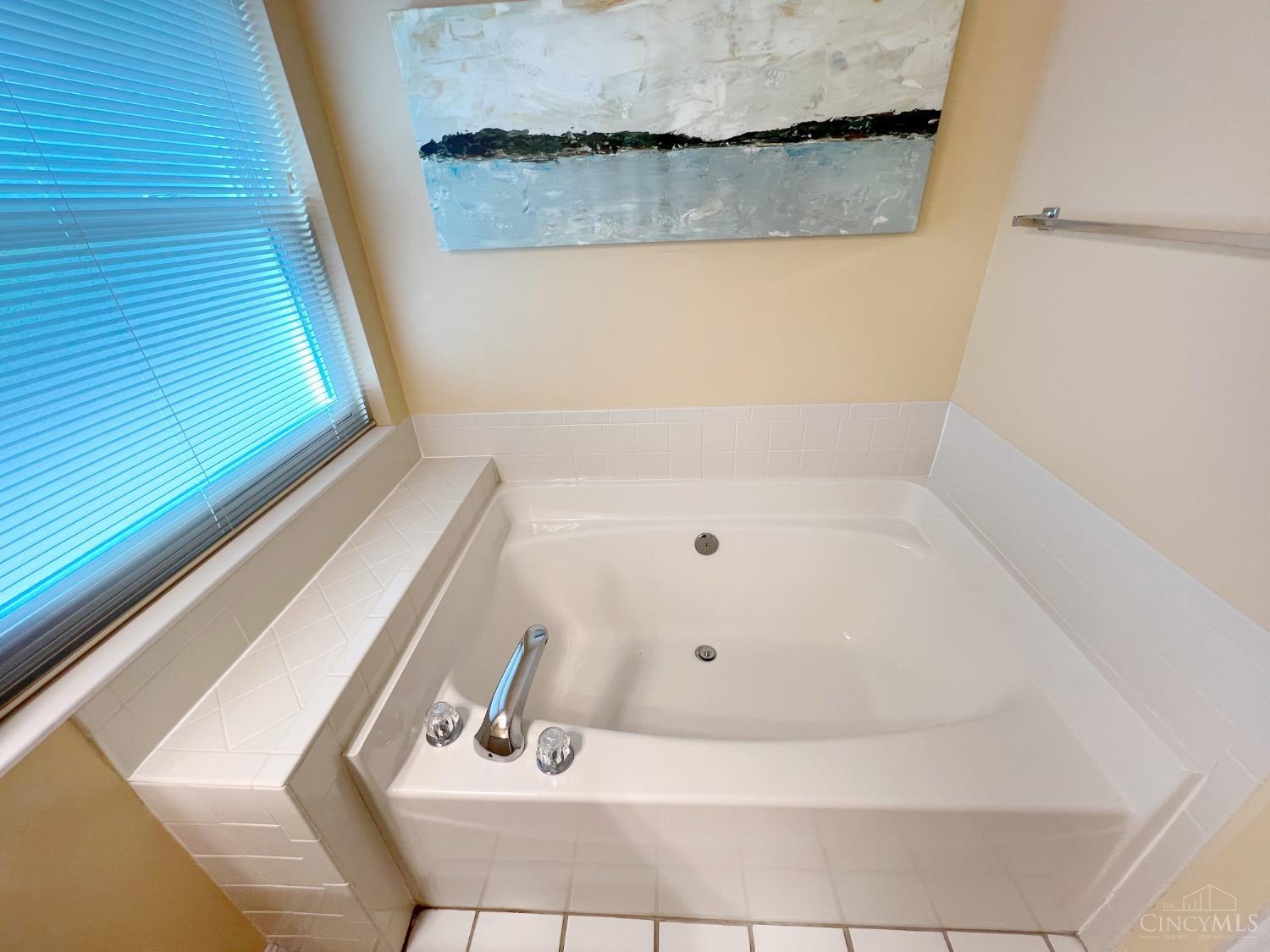 8408 Ridge Pointe Court, Unit 13 Reading, OH 45237 - Photo 18 of 39 Here's a photo of the garden bathtub in the primary bathroom.