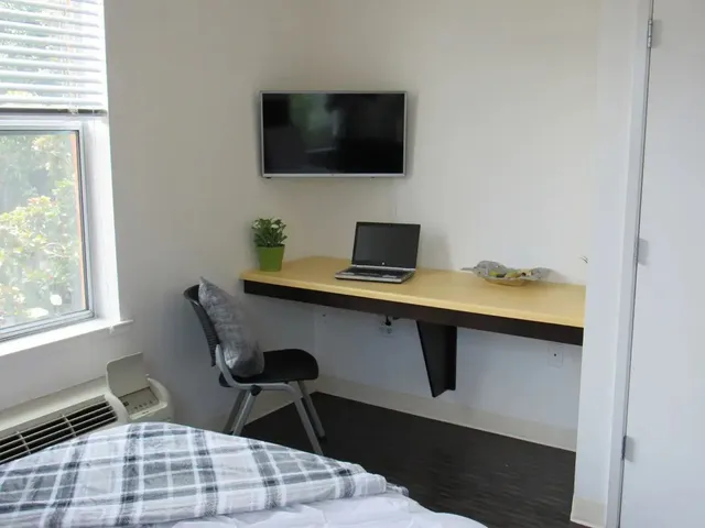 a workspace with furniture and window