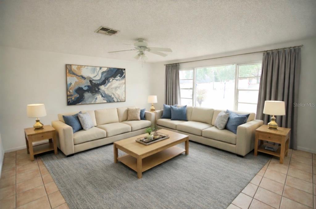 606 Water Road Ocala, FL 34472 - Photo 5 of 34 a living room with furniture and a large window