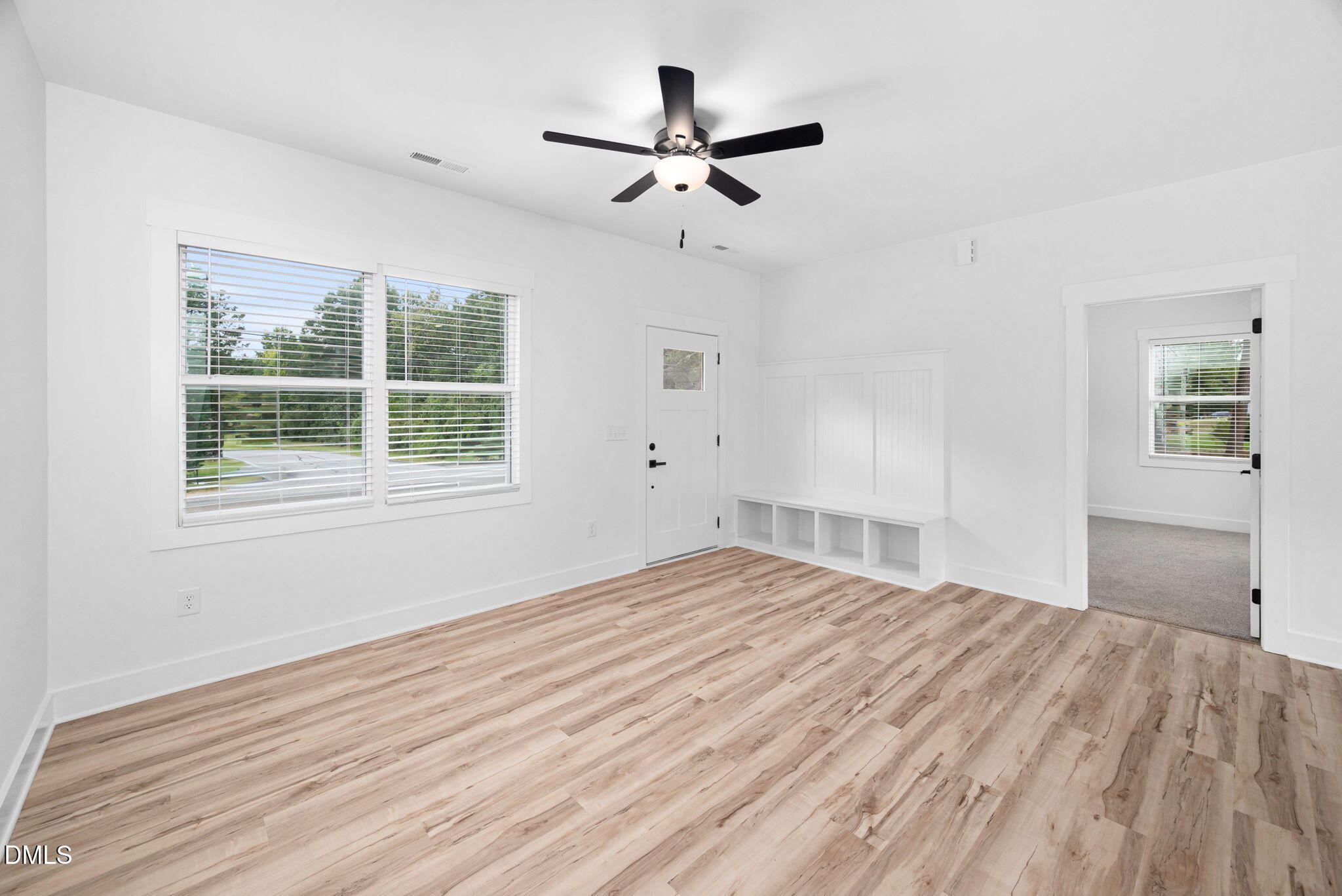 305 West Barden Street Roxboro, NC 27573 - Photo 11 of 31 a view of empty room with wooden floor and fan