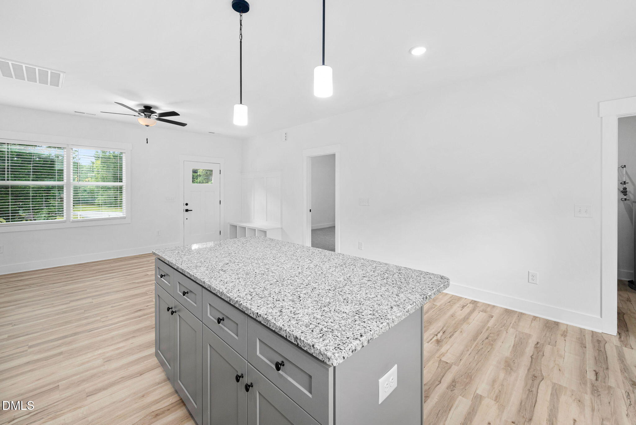 305 West Barden Street Roxboro, NC 27573 - Photo 13 of 31 a bathroom with a granite countertop sink a vanity and a large mirror