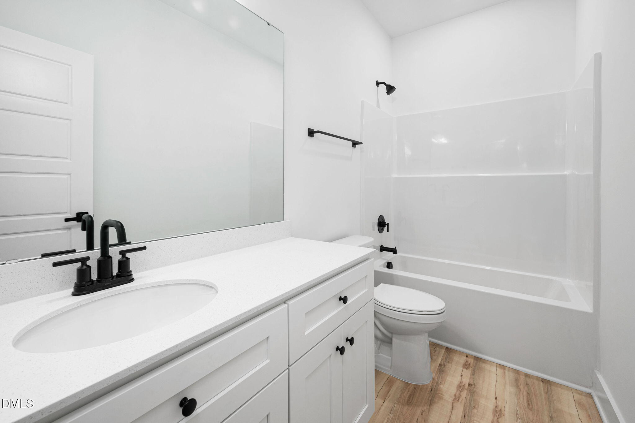 305 West Barden Street Roxboro, NC 27573 - Photo 16 of 31 a bathroom with a sink a toilet and a tub